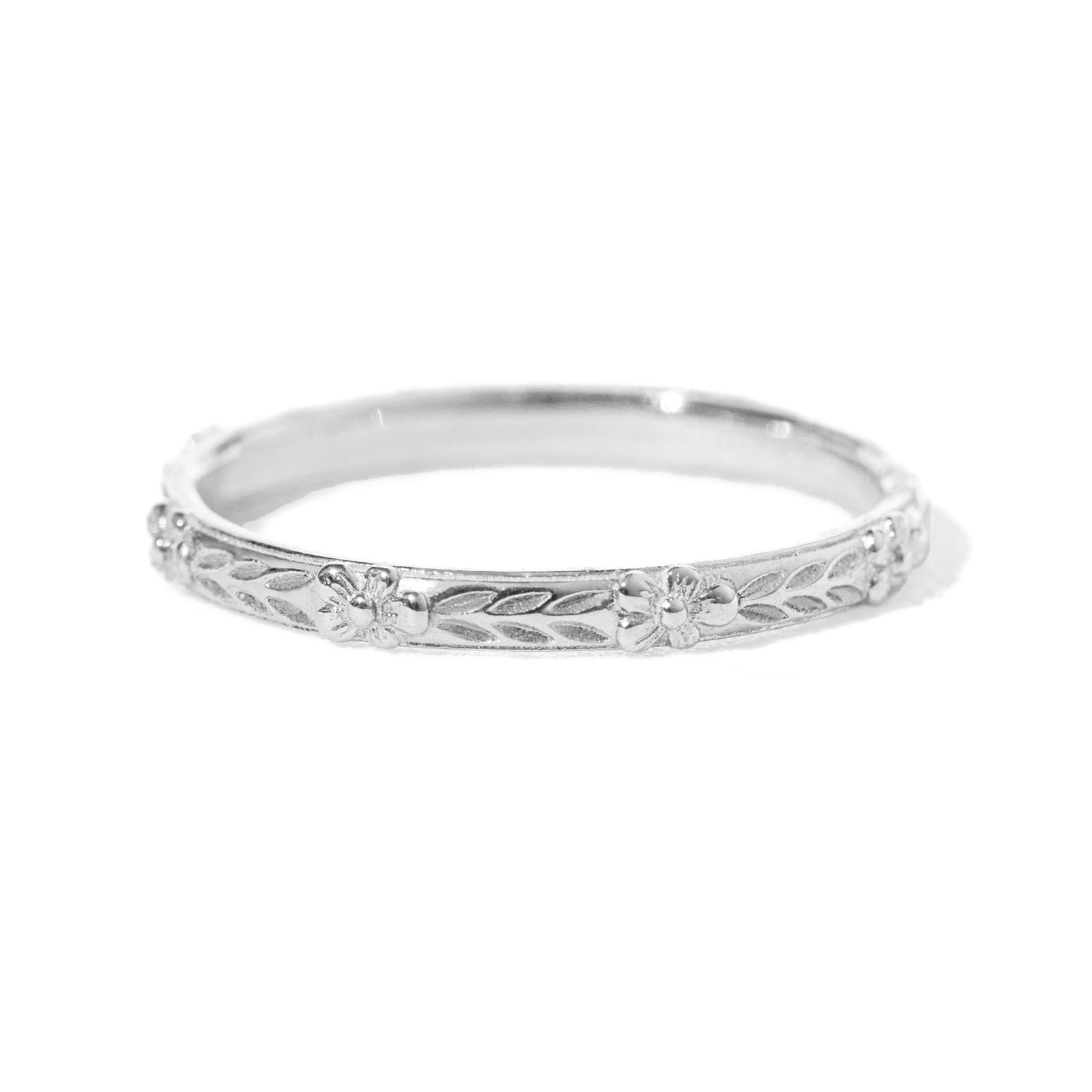 Jamie Park Jewelry - Flower Market Band Add effortless elegance to your everyday style with the Flower Market Band. The intricate vintage inspired pattern exudes sophistication, making it a perfect choice for both casual and formal occasions. Elevate your look with this beautiful and versatile piece, perfect as a standalone band or as a complement to your engagement ring or wedding band. Edit alt text