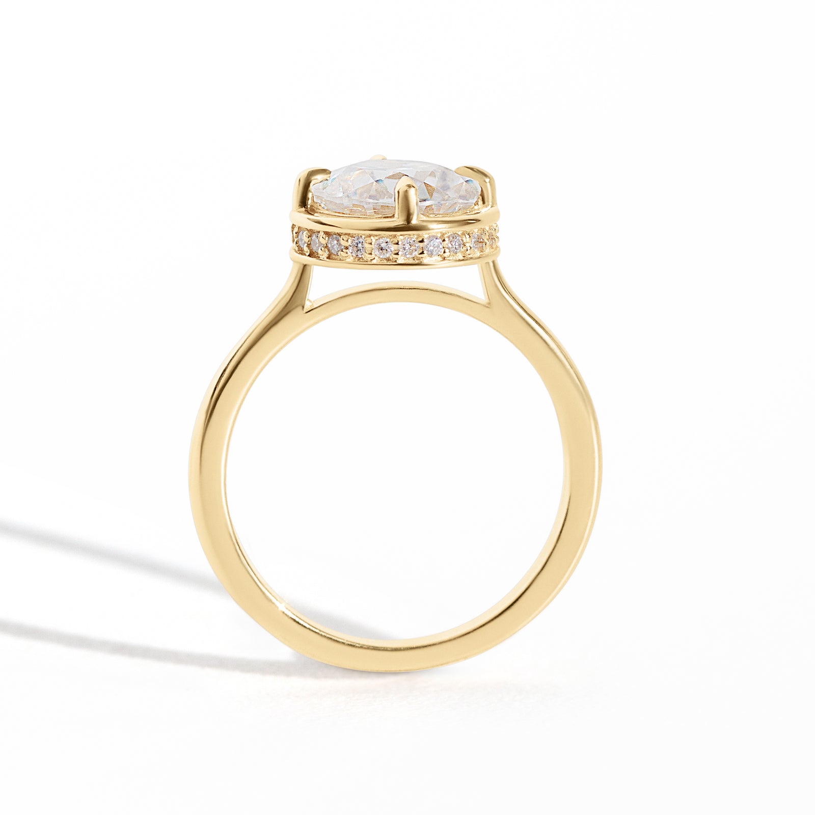 The Riviera Hidden Halo Ring features a 2ct Old European cut diamond or moissanite set in a collet setting, with a delicately highlighted hidden halo beneath. This elegant and romantic design effortlessly blends old-world charm with a modern aesthetic. It’s the perfect choice for engagements, milestone celebrations, birthdays, and anniversaries, making it a timeless piece.