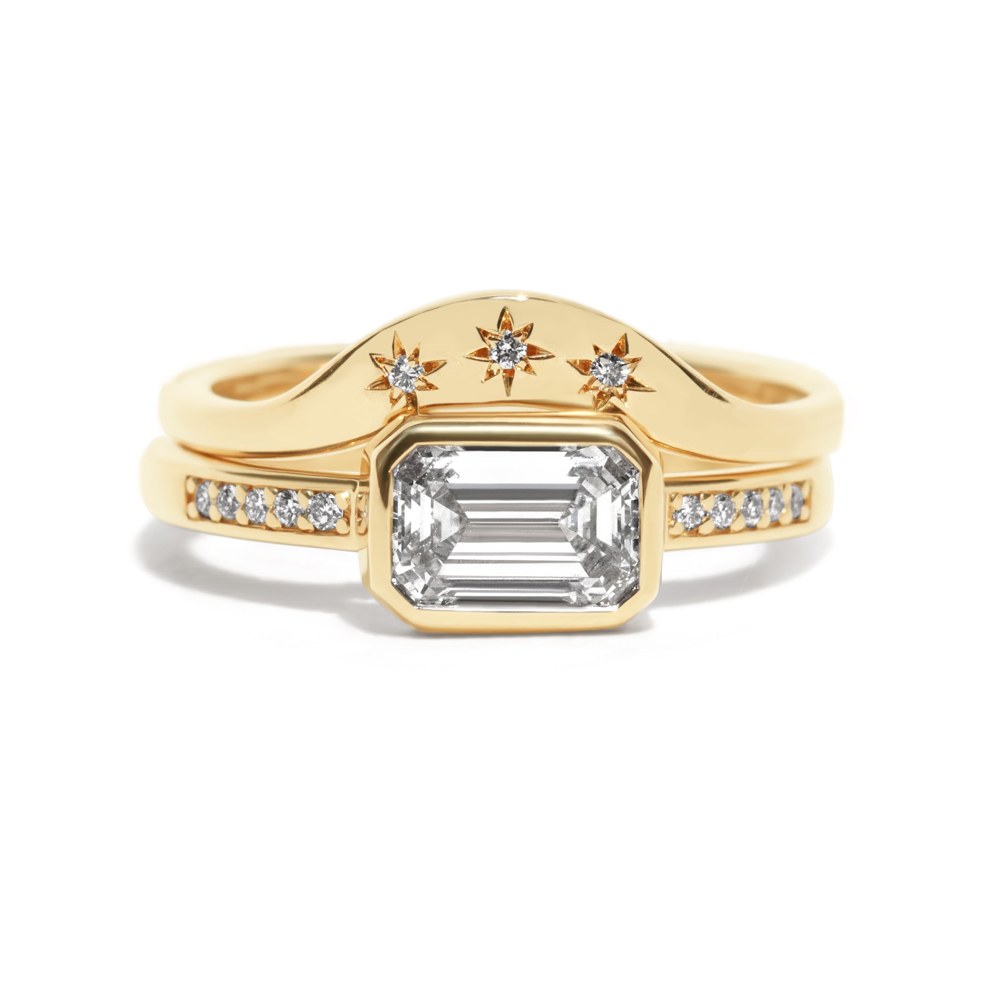 This gently curved, sculpted Starburst Diamond Contour Band is designed to complement your engagement ring with effortless elegance. Its graceful silhouette and subtle sparkle make it a timeless accent to your ring stack.