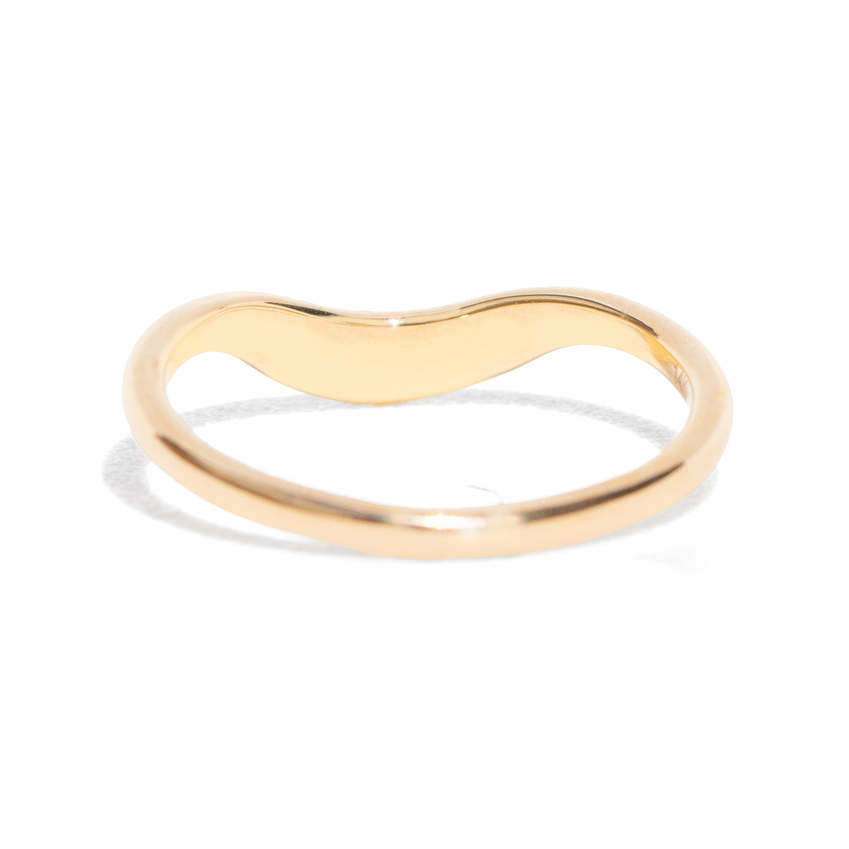 This gently curved, sculpted Starburst Diamond Contour Band is designed to complement your engagement ring with effortless elegance. Its graceful silhouette and subtle sparkle make it a timeless accent to your ring stack.