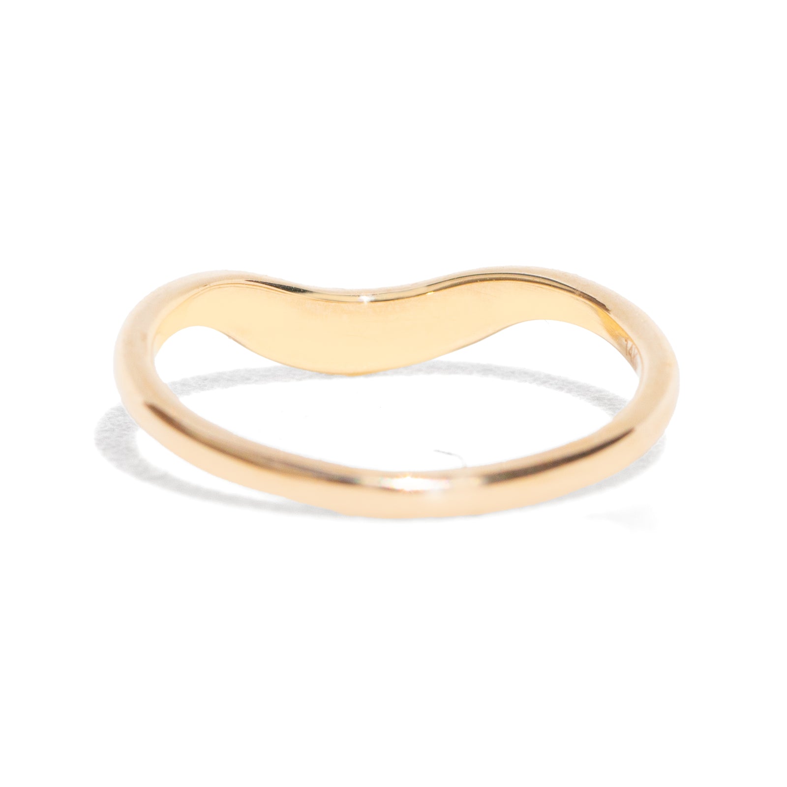 This gently curved, sculpted Starburst Diamond Contour Band is designed to complement your engagement ring with effortless elegance. Its graceful silhouette and subtle sparkle make it a timeless accent to your ring stack.