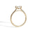Gold ring with a diamond on a white background