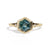 Gold ring with a green hexagon sapphire with two side diamonds on a white background