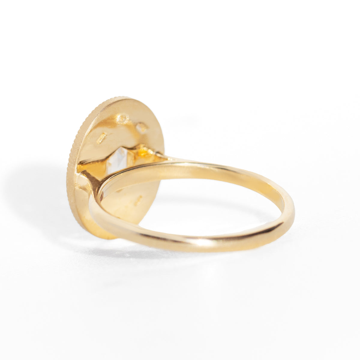 Gold ring on a white background