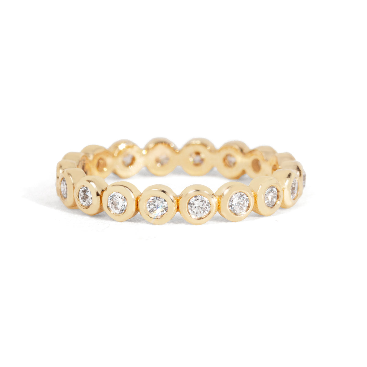 Gold ring with embedded diamonds on a white background