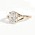 Gold ring with a large diamond on a white background