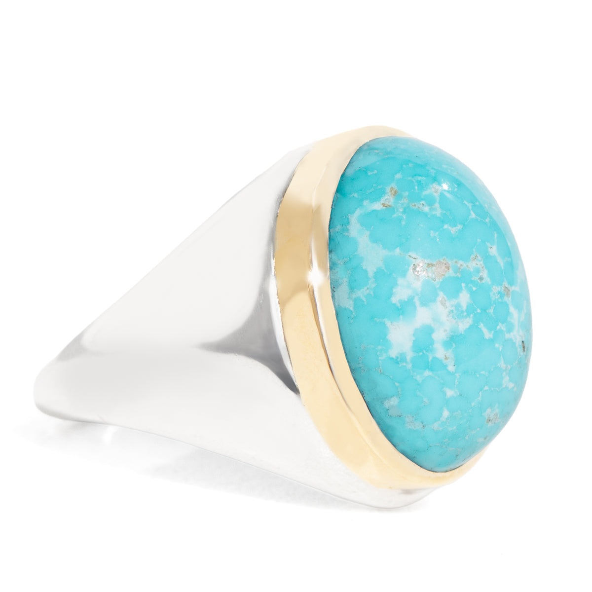 Ring with turquoise stone and gold band on a white background