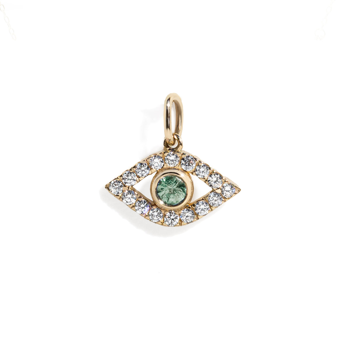 Gold eye charm with a green sapphire in the center surrounded by white diamond frame on a gold chain against white background. 