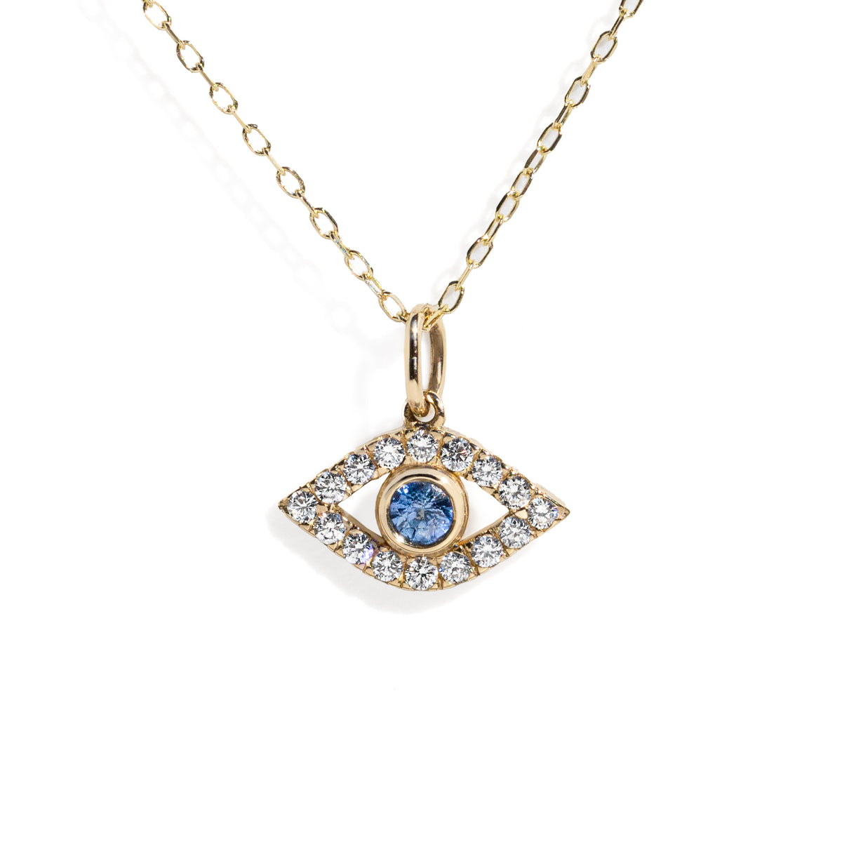 Gold necklace with an eye-shaped pendant featuring a blue gemstone on a white background