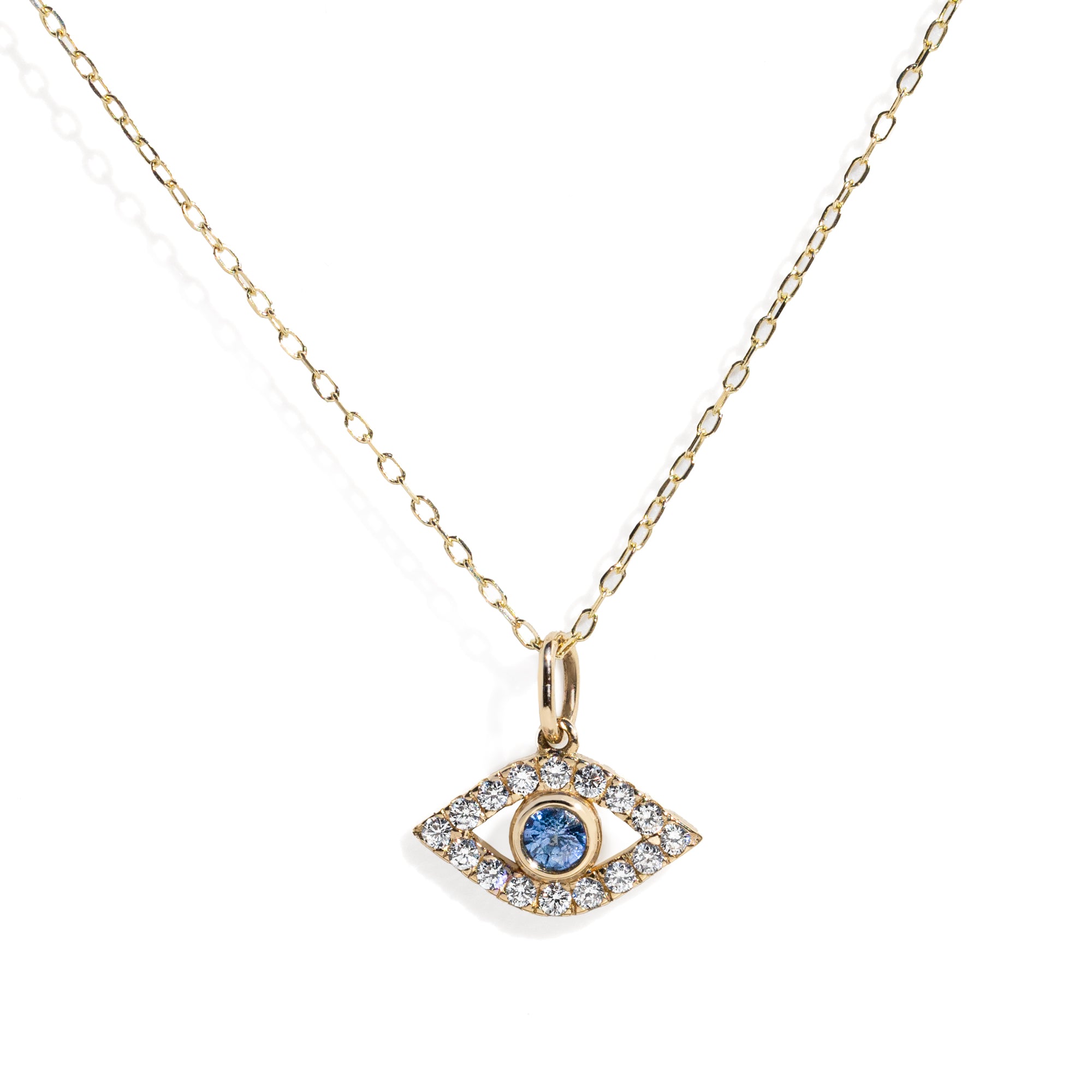 Gold evil eye necklace with an eye-shaped pendant featuring a blue gemstone on a white background