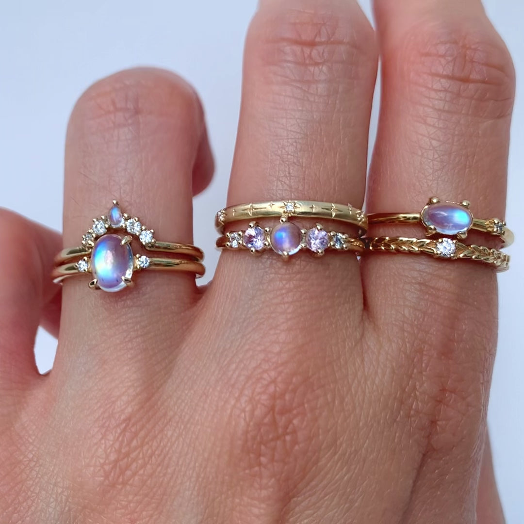 Perfect for daily wear, the Moonstone Orbit Ring features a simple silhouette that is enhanced by a stunning iridescent rainbow moonstone and diamond accents.