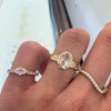 three diamond rings worn on a hand