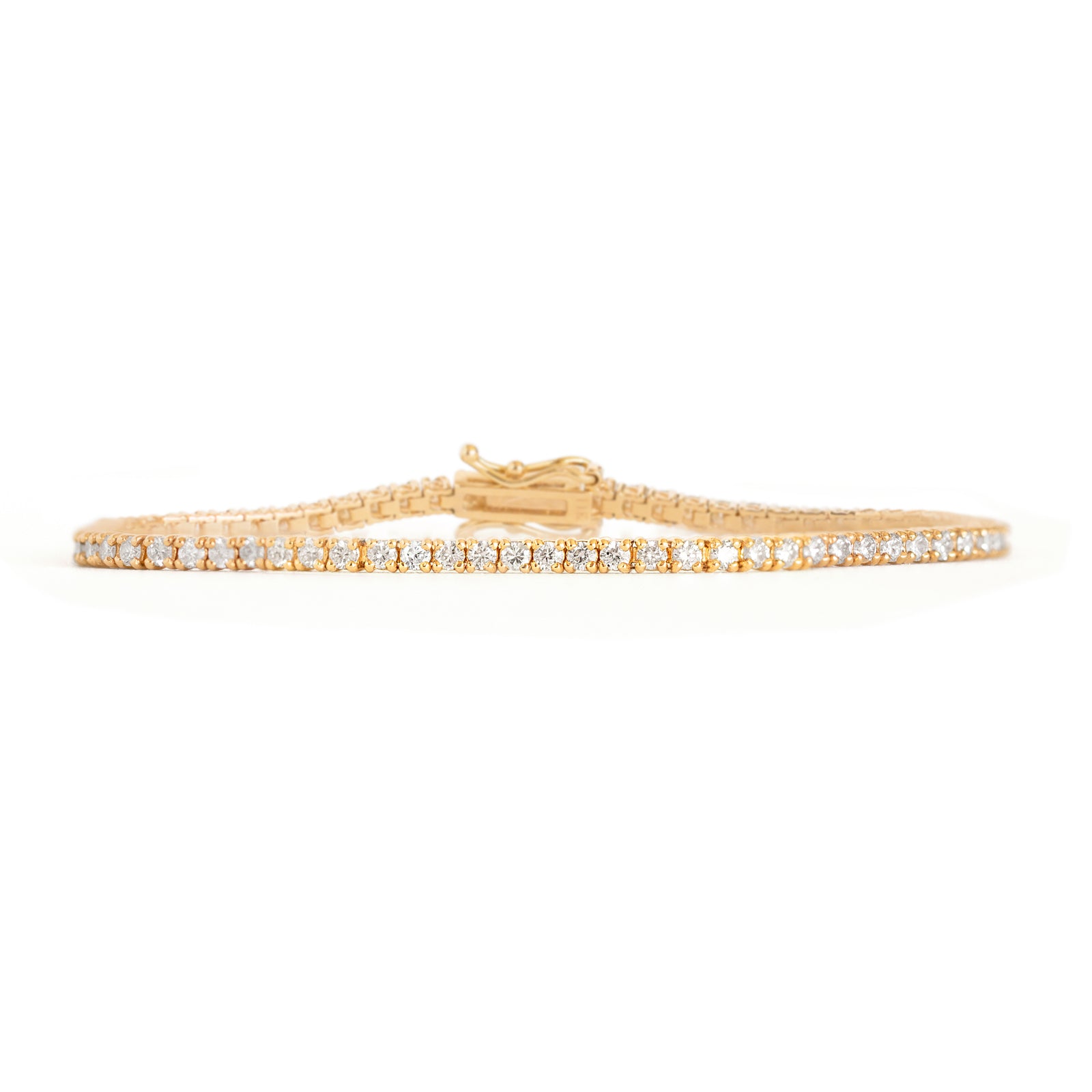 This tennis bracelet is crafted with dazzling lab or natural diamonds, making it luxurious yet minimalistic fine jewelry&nbsp;for any occasion. Its timeless design and movement will be sure to make heads turn. A perfect gift to someone special or yourself. Model is wearing 2CT.