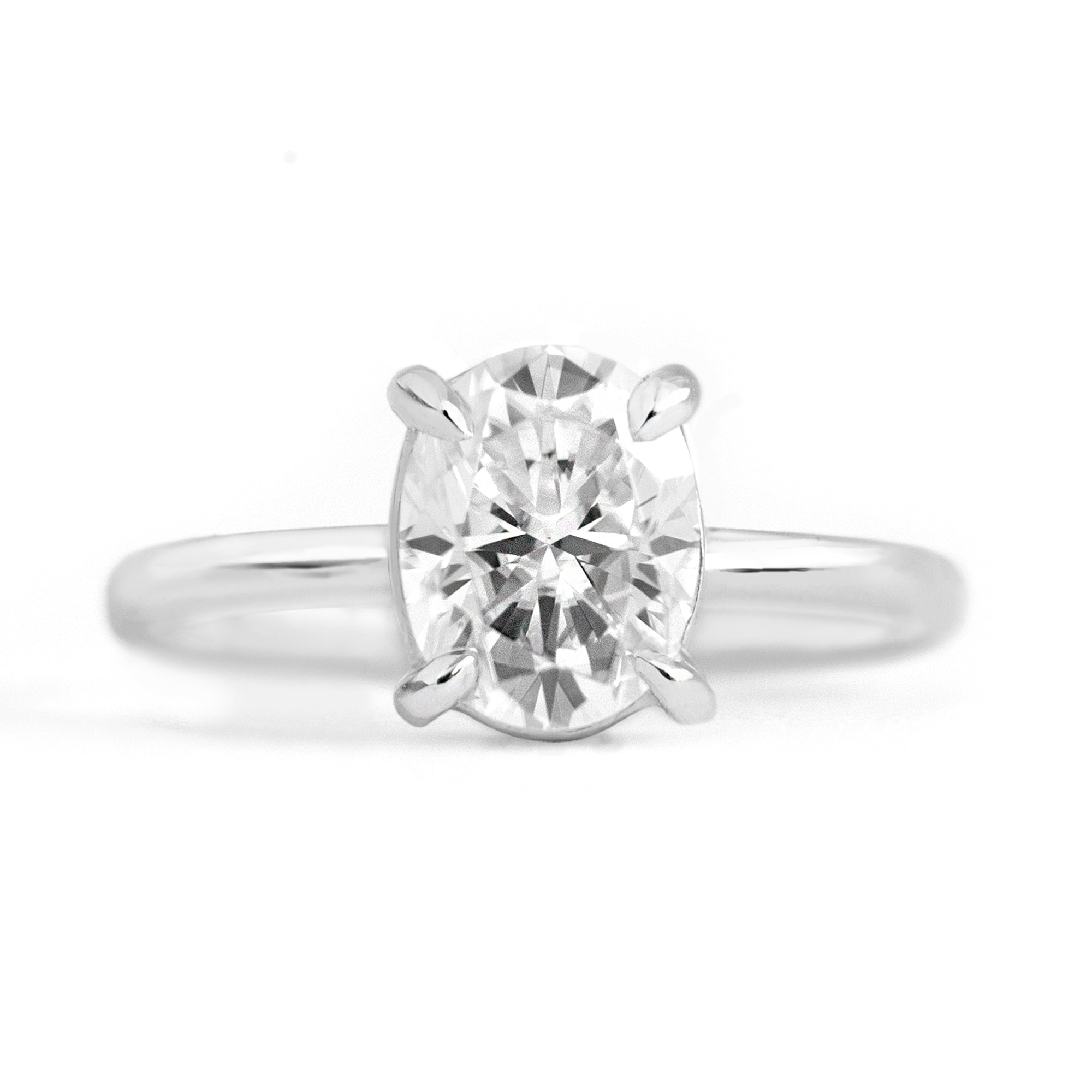 Magnolia Oval Four Prong Solitaire Ring | Lab White Sapphire | Moissanite