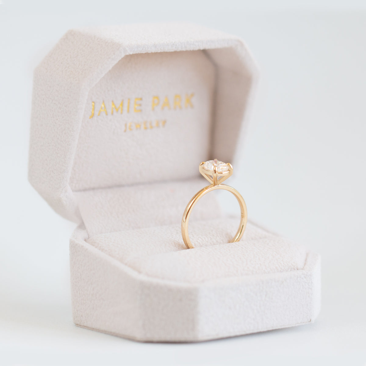 Magnolia Oval Four Prong Solitaire Ring