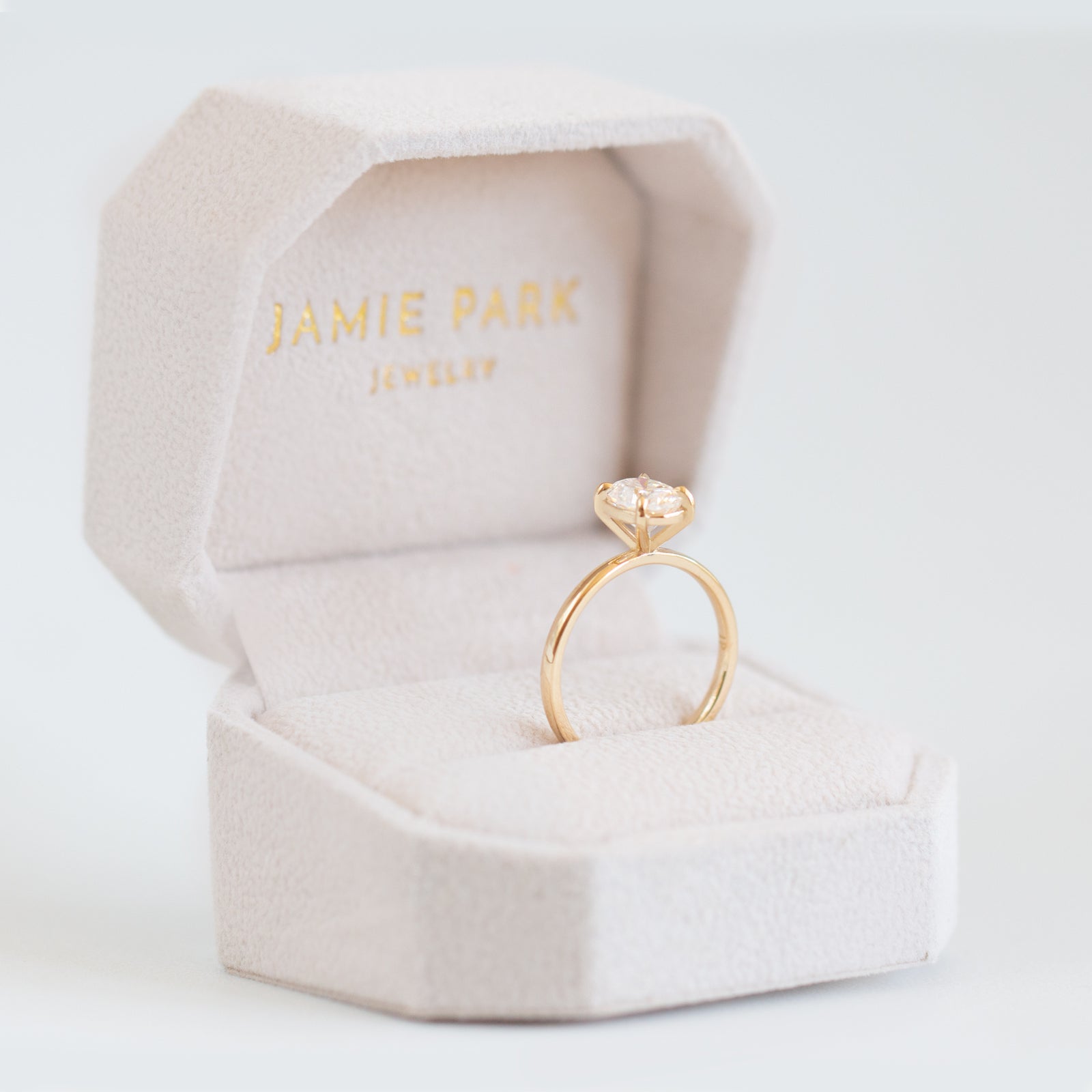 Magnolia Oval Four Prong Solitaire Ring